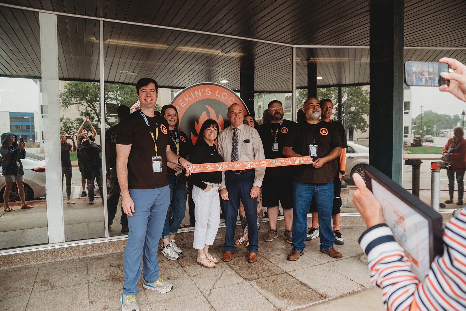 Pekin's Local Dispensary & Supply team cutting the Pekin Area Chamber of Commerce ribbon at the grand opening